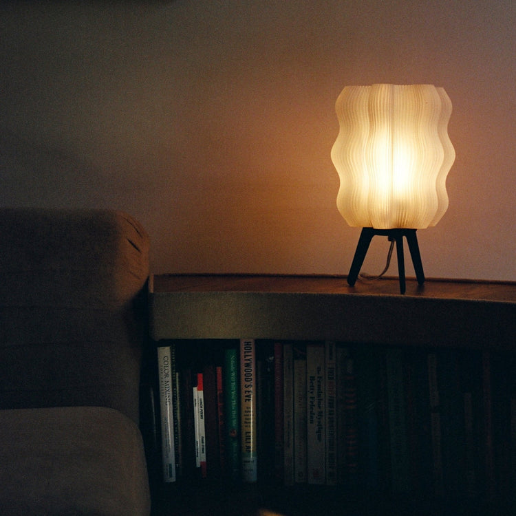 Matte black Wavy Lamp by Wooj Design, 3D printed sculptural table lamp with a wavy, AI-inspired modern design.