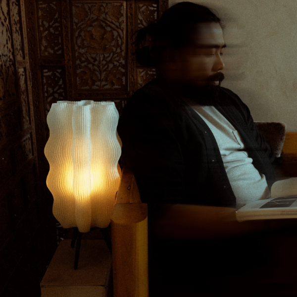 Matte black Wavy Lamp by Wooj Design, 3D printed sculptural table lamp with a wavy, AI-inspired design for modern lighting.