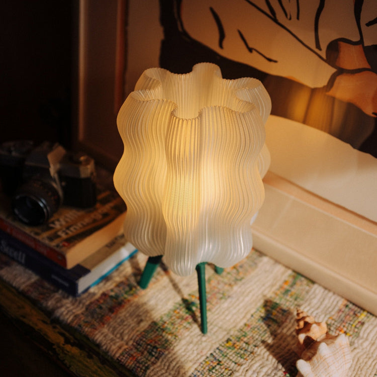 Matte black Wavy Lamp by Wooj Design, 3D printed sculptural table lamp with a wavy, artistic design for modern lighting.