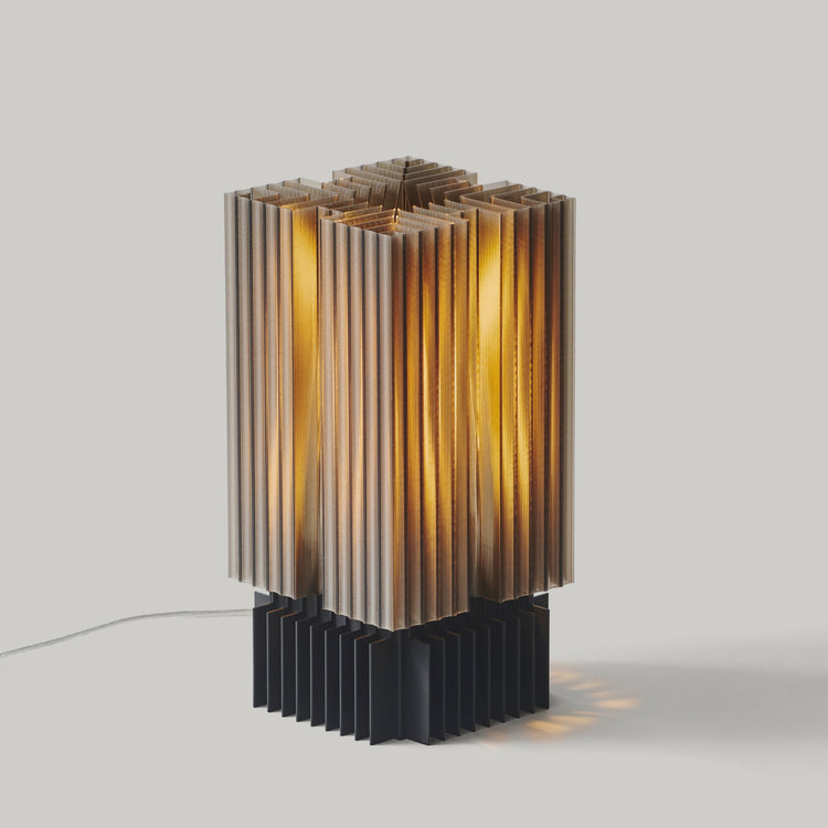 Wooj Design Brut Lamp, a 3D printed sculpture inspired by brutalist architecture with a smoky finish, showcasing bold geometric design.