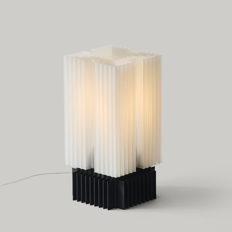 Wooj Design Brut Lamp, a 3D printed sculpture inspired by brutalist architecture with a smoky finish.
