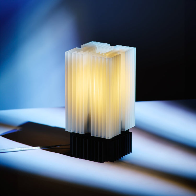 Wooj Design Brut Lamp, a 3D printed sculpture inspired by brutalist architecture with a smoky finish.