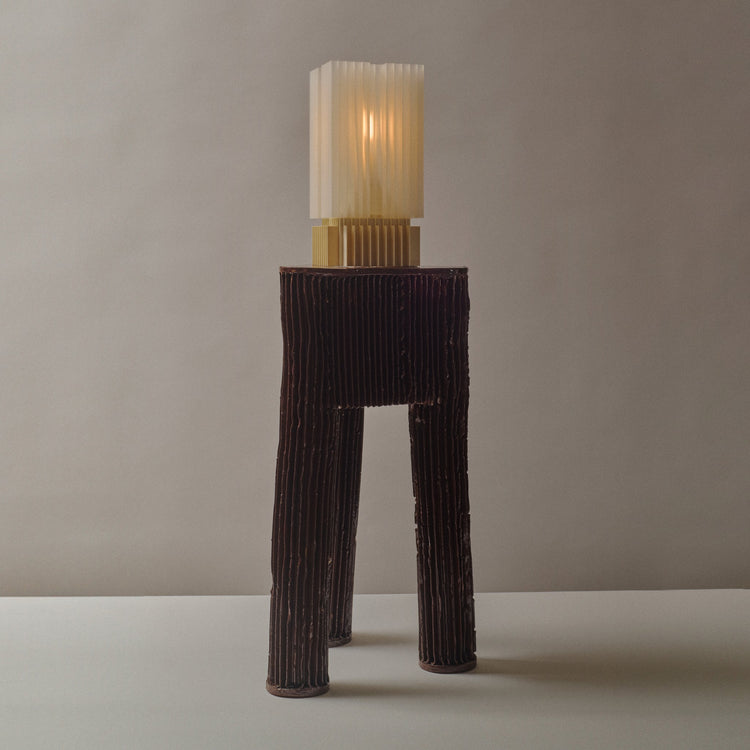 Wooj Design Brut Lamp, a 3D printed sculpture inspired by brutalist architecture, with a textured concrete-like finish.