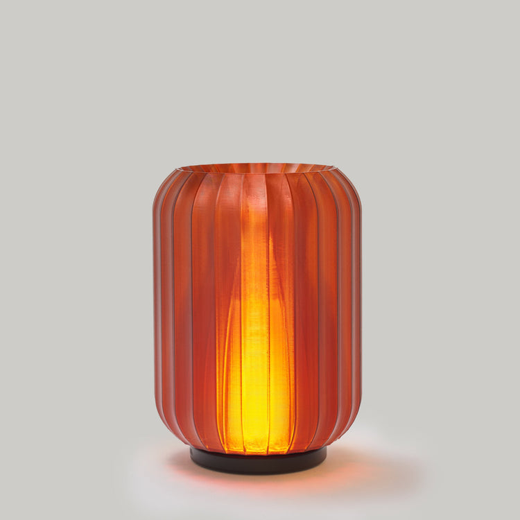 Modern Wooj Design cordless Allium table lamp with rechargeable mini accent light in smoke color, showcasing sleek and compact design.