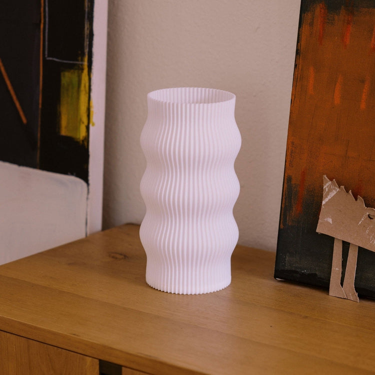 Terra Labs Wub Table Lamp featuring a modern, sculptural design with a smooth, curved shape and soft lighting.