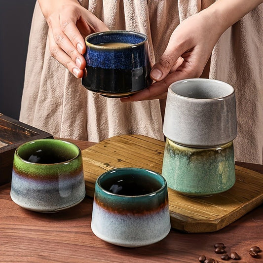 Beautiful handmade ceramic coffee mugs with differently colored unique designs
