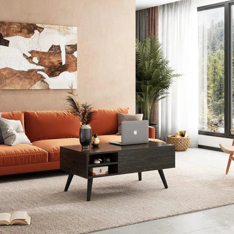 Modern living room with abstract art and orange couch