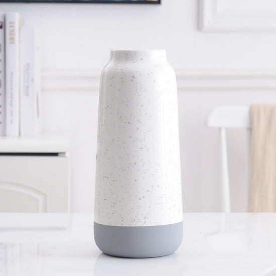 White and gray ceramic vase with a modern design, ideal for floral home decoration, by FLIPSTYLEZLLC.