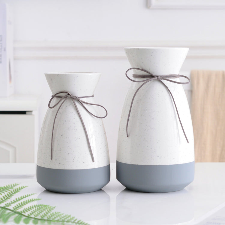 White and gray ceramic vase with modern design, perfect for floral home decoration by FLIPSTYLEZLLC.