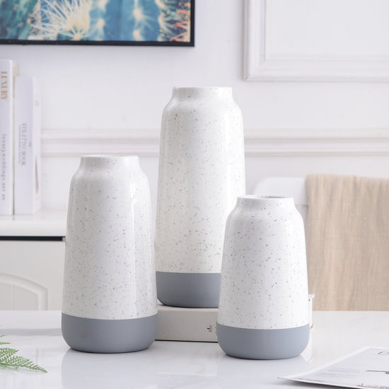 White and gray ceramic vase with a modern, minimalist design, perfect for floral home decoration by FLIPSTYLEZLLC.