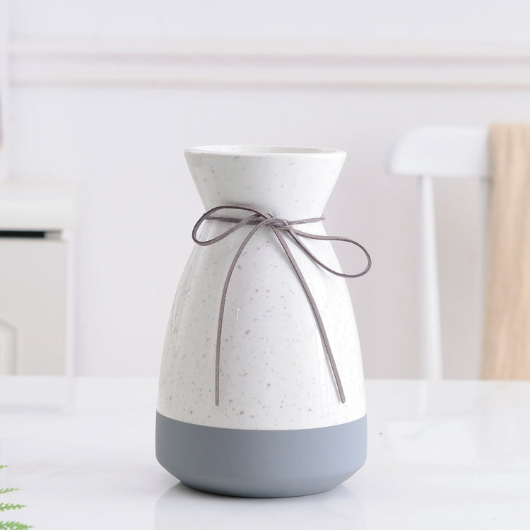 White and gray ceramic vase with modern design, ideal for floral home decoration, by FLIPSTYLEZLLC.