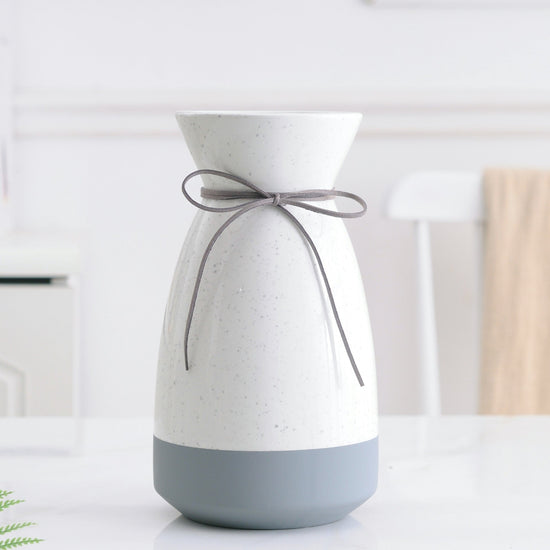 White and gray ceramic vase with a modern design, ideal for floral home decoration, by FLIPSTYLEZLLC.