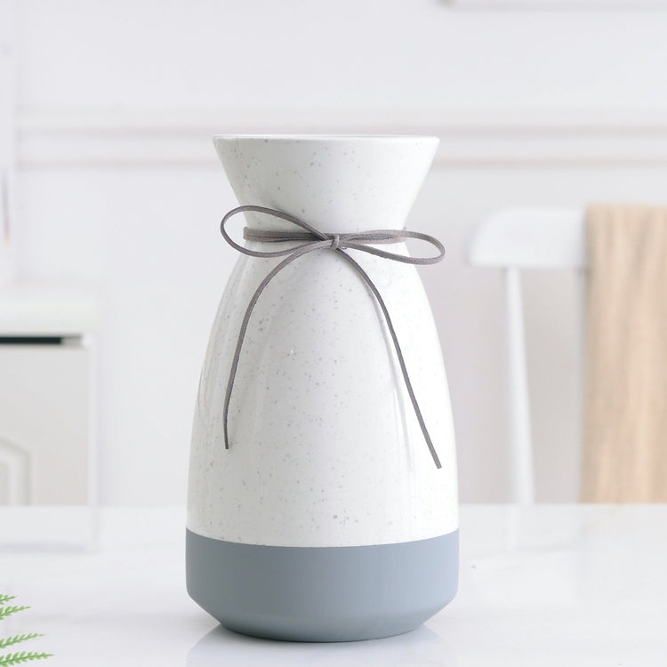 White and gray ceramic vase with a modern design, ideal for floral home decoration, by FLIPSTYLEZLLC.