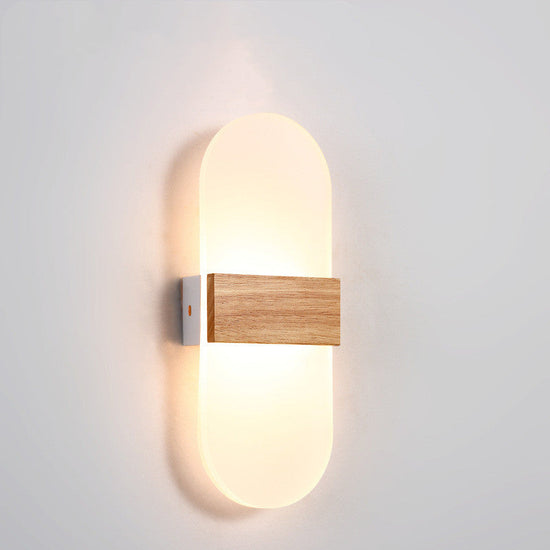 Wooden LED wall lamp by FLIPSTYLEZLLC, modern design ideal for living rooms, bedrooms, and study areas, illuminated with soft light.