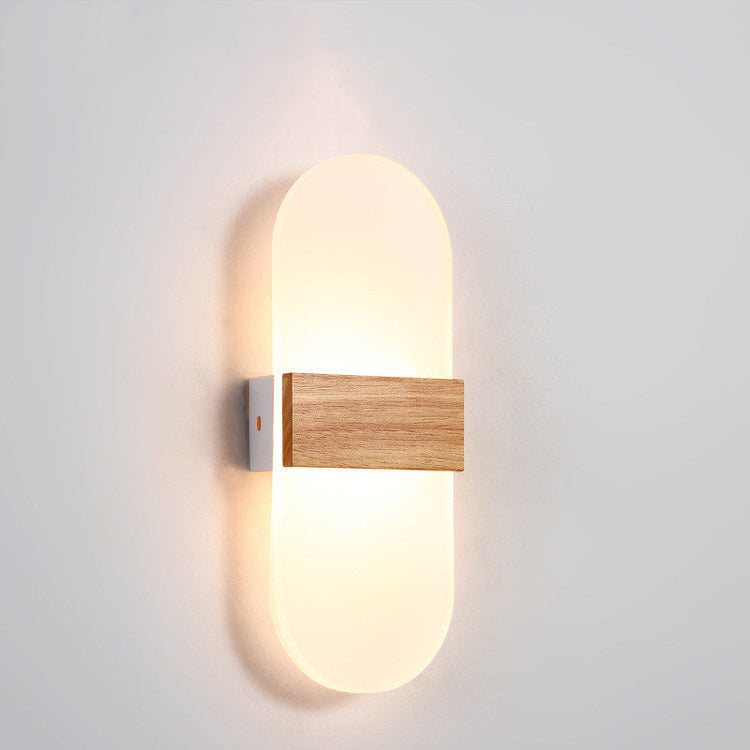 Wooden LED wall lamp by FLIPSTYLEZLLC, modern design ideal for living rooms, bedrooms, and study areas, illuminated with soft light.