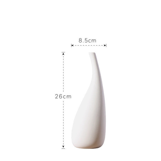White ceramic water drop vase by FLIPSTYLEZLLC, featuring a simple modern design with dried flowers and floral ornaments.