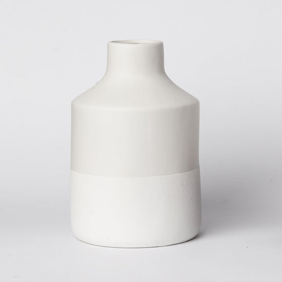 Minimalist ceramic vase with matte finish from Porto Boutique, ideal as modern home decor accent.