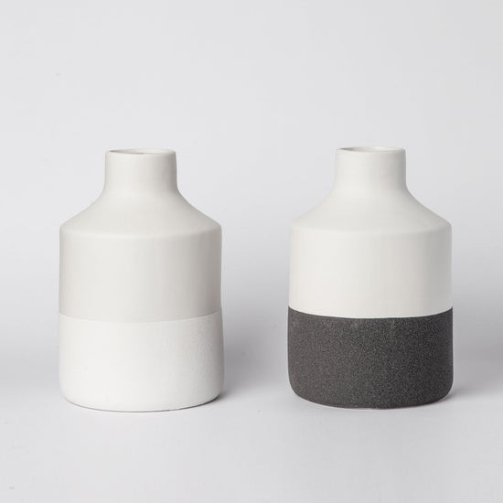 Minimalist ceramic vase with matte finish from Porto Boutique, designed for modern home decor displays.