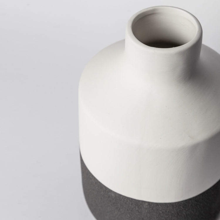Minimalist ceramic vase with matte finish by Porto Boutique, showcasing a sleek, modern home decor piece.