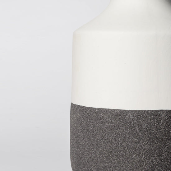 Minimalist ceramic vase with matte finish from Porto Boutique, featuring a sleek design suitable for modern home decor.