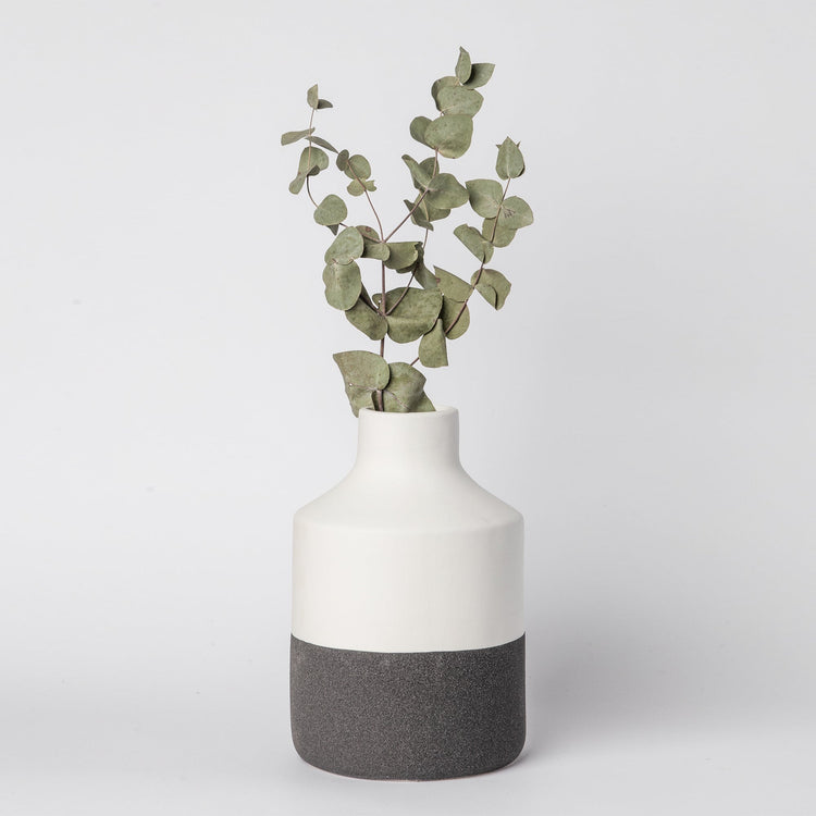 Minimalist ceramic vase with matte finish from Porto Boutique, showcasing a sleek, modern home decor piece.