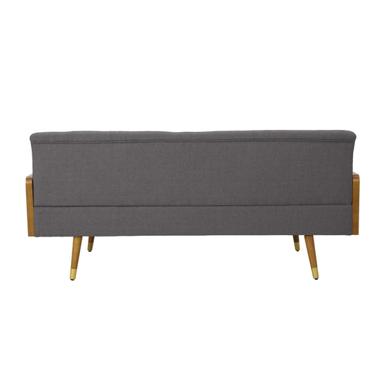 A grey fabric Aidan mid-century modern tufted sofa with sleek design and plush cushions on a contemporary living room floor.