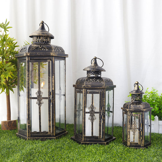 Set of 3 large metal and glass outdoor decorative candle lanterns for patio and garden decor by Lootquake LLC