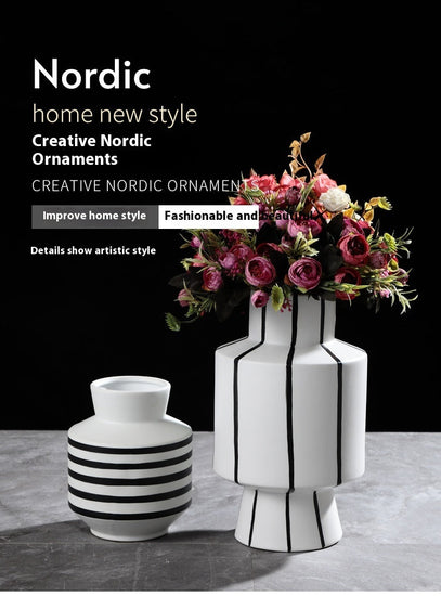 Black and white striped ceramic vase with a sleek, modern design, perfect for contemporary home decor by FLIPSTYLEZLLC.