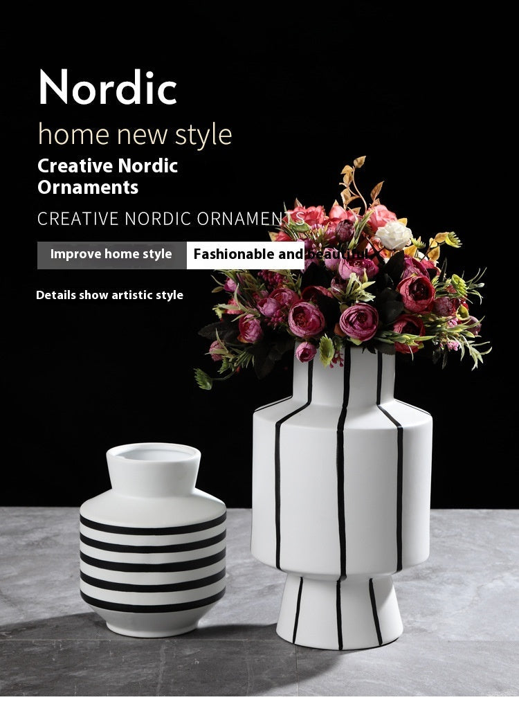 Black and white striped ceramic vase with a sleek, modern design, perfect for contemporary home decor by FLIPSTYLEZLLC.