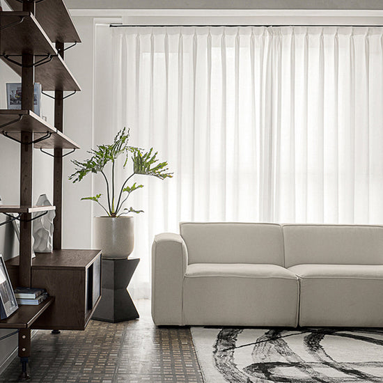 Modern L-shaped velvet sofa in tofu fabric with sleek design, perfect for stylish living room seating by FLIPSTYLEZLLC.