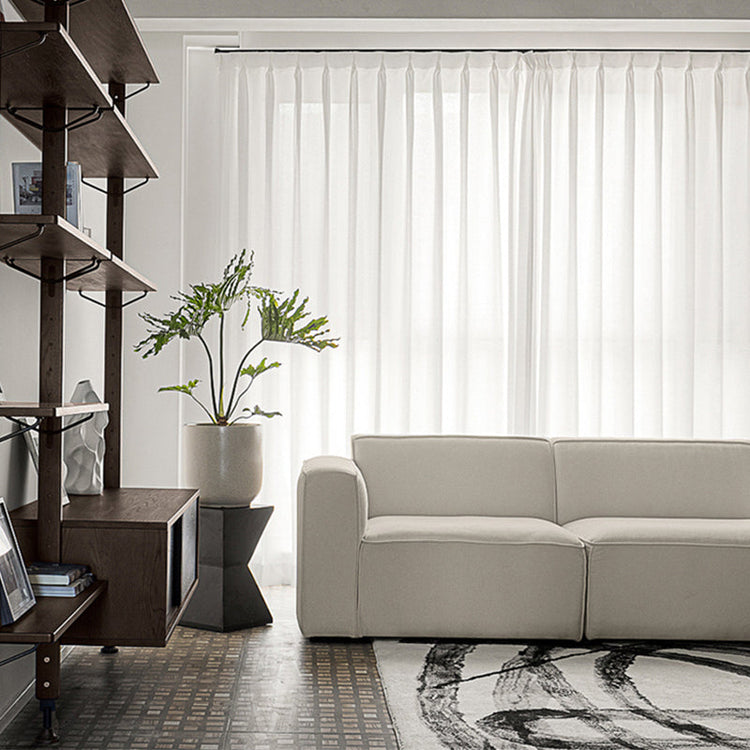 Modern L-shaped velvet sofa in tofu fabric with sleek design, perfect for stylish living room seating by FLIPSTYLEZLLC.