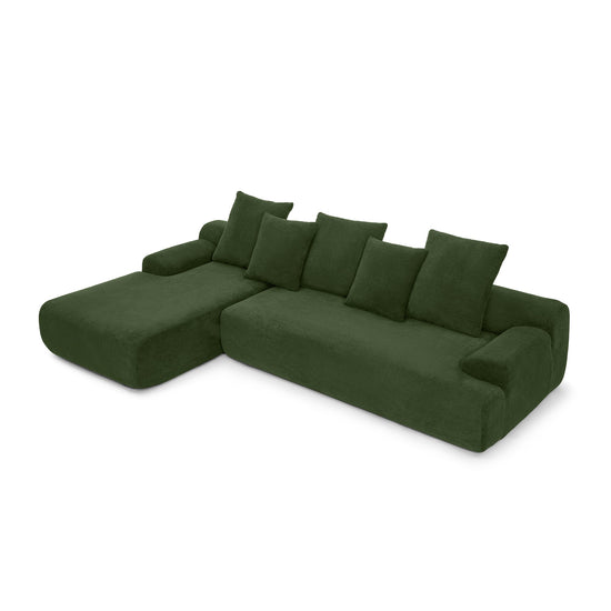 Green velvet L-shaped sectional sofa by HouseOfZazla with modern modular design, featuring plush cushions and sleek upholstery.