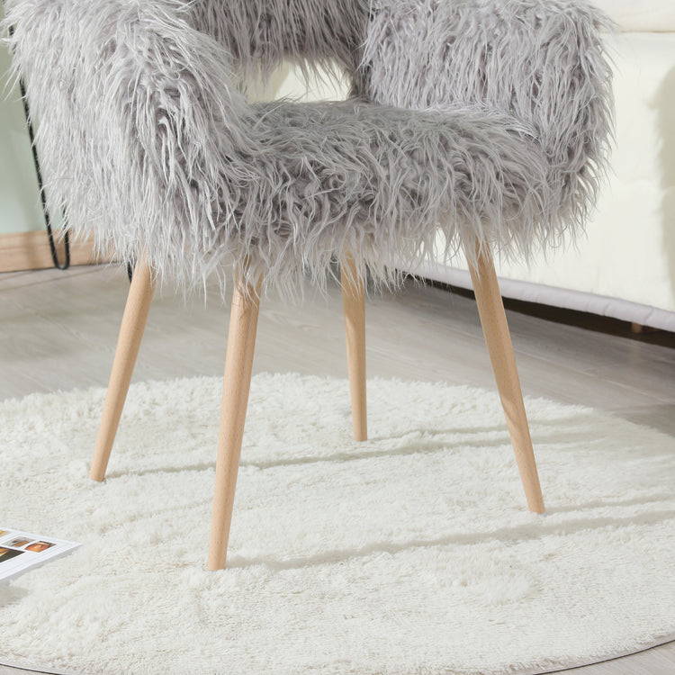 Grey faux fur upholstered dining chair with metal legs, modern design, comfortable seating for dining room.