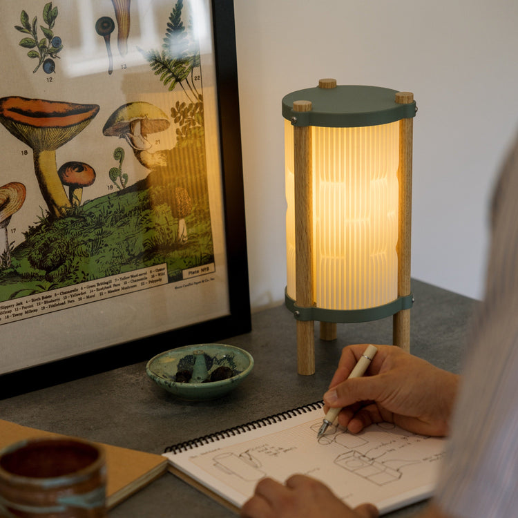 Terra Labs Toro table lamp with sleek modern design, featuring a cylindrical base and a stylish fabric lampshade.