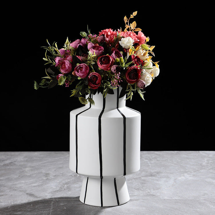 Black and white striped ceramic vase with a sleek modern design, ideal for contemporary home decor by FLIPSTYLEZLLC.