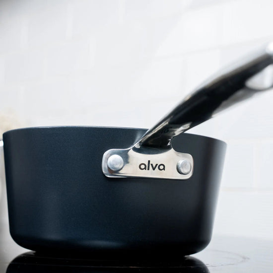 Alva Cookware 2-quart saucepan with lid from a 4-piece stock pot set, stainless steel with a sturdy handle and matching lid.