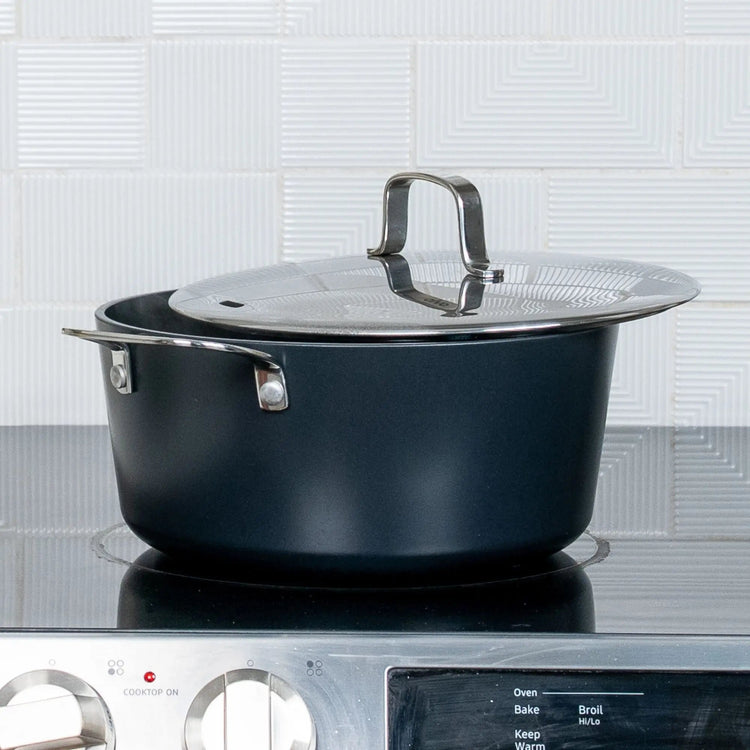 Alva Cookware 4-piece cookware set with pots and pans, stainless steel handles, and glass lids for versatile kitchen use.