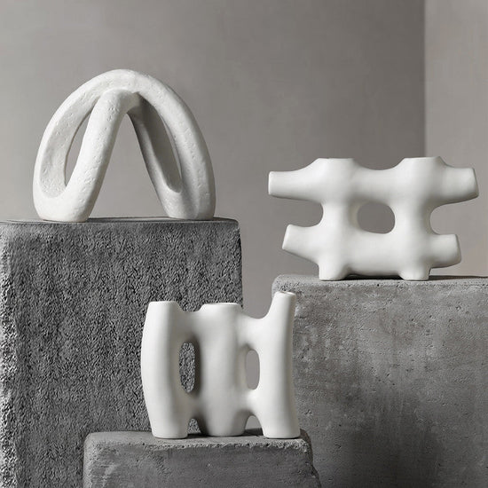 White ceramic vase by FLIPSTYLEZLLC, designed for creative flower arrangements and modern living room decor.