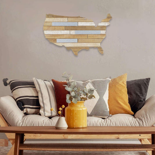 Wooden wall art of the United States in a living room with a sofa and decorative items.