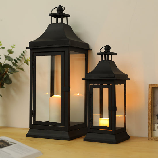 Set of two JHY DESIGN outdoor decorative candle lanterns, 13 and 19.5 inches tall with glass panels and metal frames.