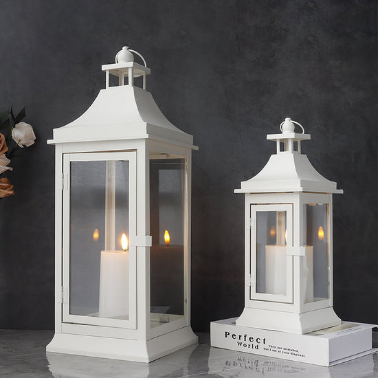 Set of two JHY DESIGN outdoor decorative candle lanterns, 19.5 and 13 inches tall with glass panels and metal frame for outdoor decor.