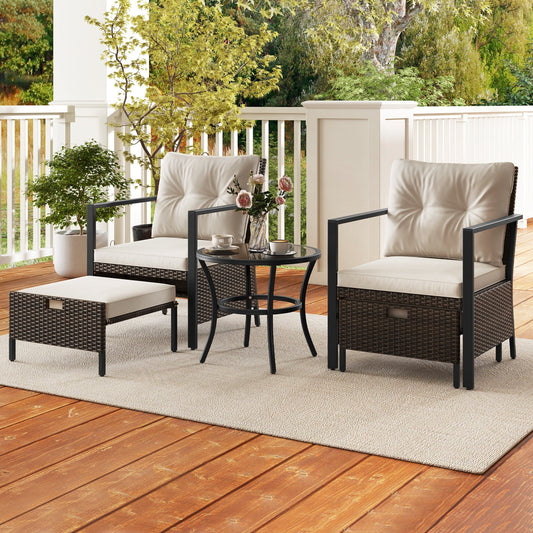 Outdoor patio furniture set with chairs, table, and ottoman on a deck.
