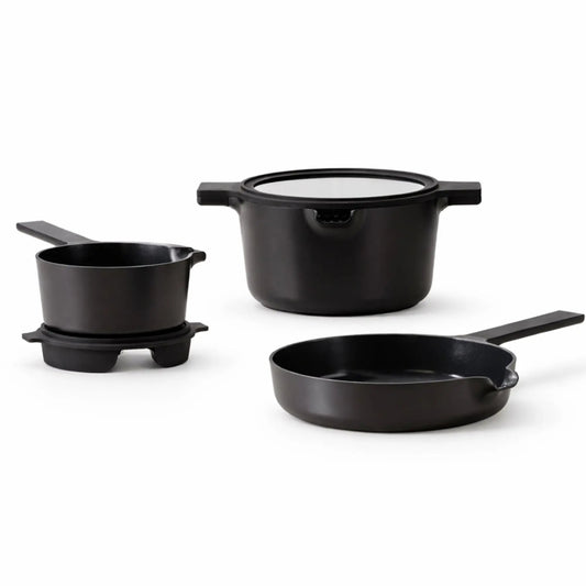 Alva Cookware 5-piece nesting set with stackable bowls and pots, featuring colorful silicone lids and stainless steel construction.
