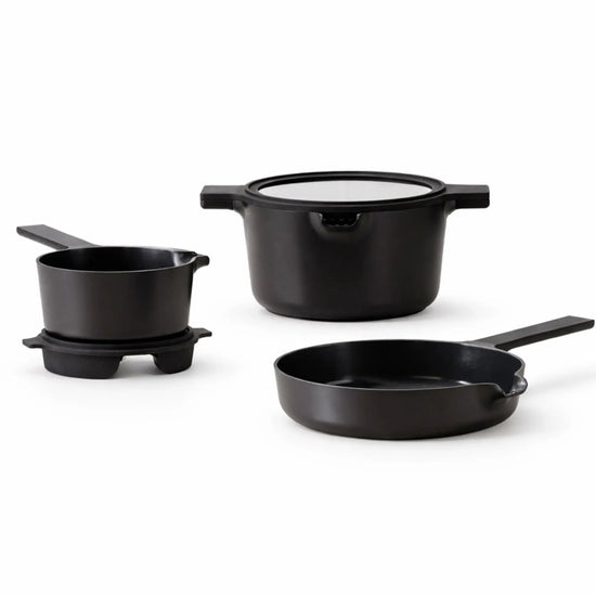 Alva Cookware 5-piece nesting set with stackable bowls and pots, featuring colorful silicone lids and stainless steel construction.