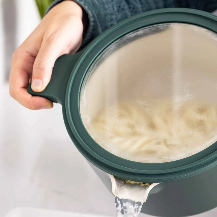 Set of five nesting cookware bowls in various sizes from Alva Cookware, stacked neatly for compact storage.