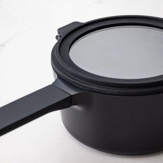 Alva Cookware 5-piece nesting set with stackable pots and bowls in various sizes for space-saving kitchen storage.