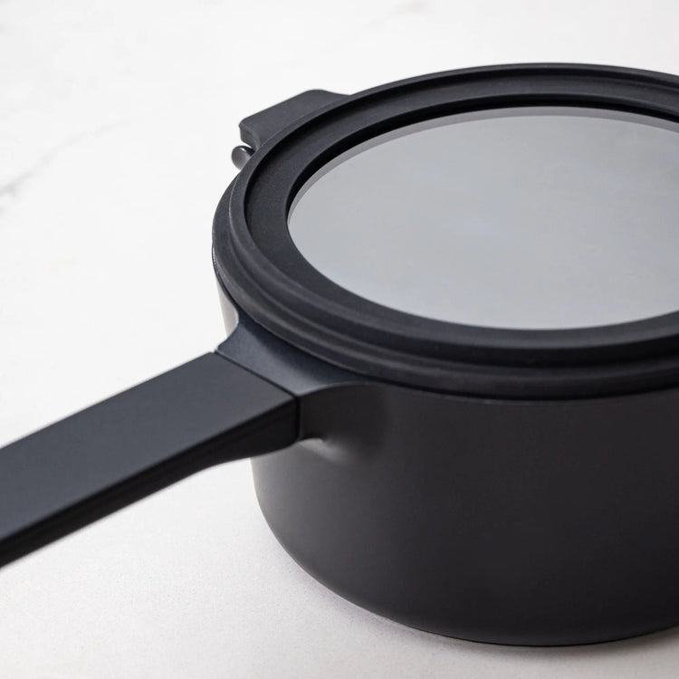 Alva Cookware 5-piece nesting set with stackable pots and bowls in various sizes for space-saving kitchen storage.