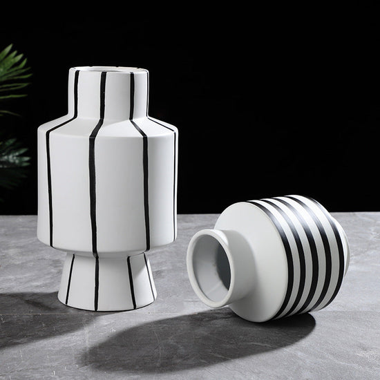 Black and white striped ceramic vase with a modern, sleek design, perfect for contemporary home decor by FLIPSTYLEZLLC