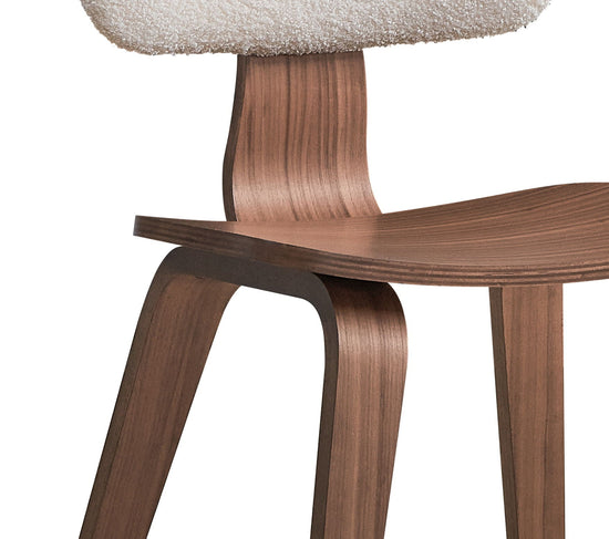Set of two HouseOfZazla Casson Bouclé Walnut side chairs with white upholstery, showcasing modern dining chair design.