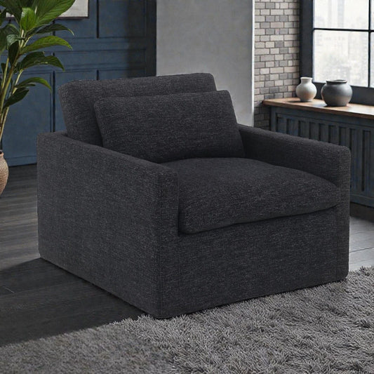 HouseOfZazla Naveen swivel chair with toss pillow, modern 360° lounge chair in stylish fabric, perfect for contemporary living spaces.